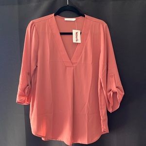 Brand new. Salmon colored business casual blouse size Medium.